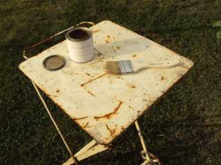Table, brush and gold-leaf paint